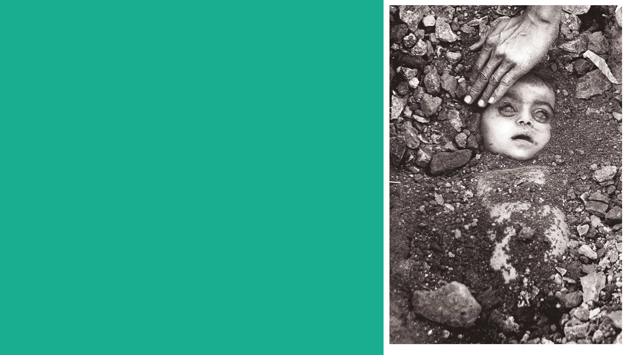 Black and white photograph of an infant being buried in a grave. Only their face is visible under the dirt and rocks. Their eyes are open and clouded. An adult's hand reaches in to touch the child's forehead. 